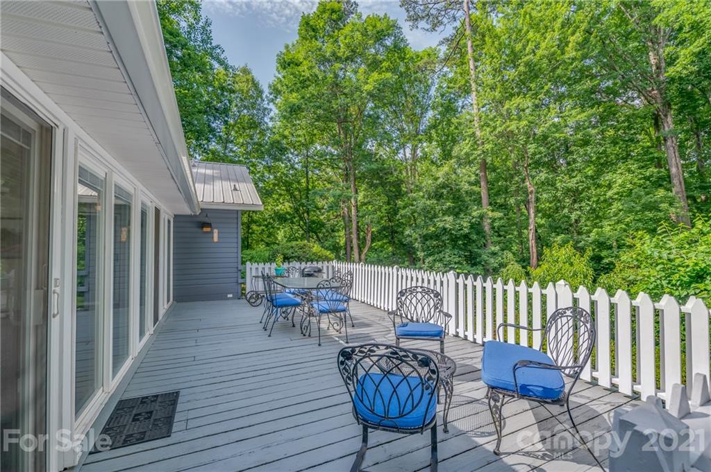 75 Hidden Hill Road Tryon, NC 28782 - Photo 5 of 36 a view of a chair and tables front of the house