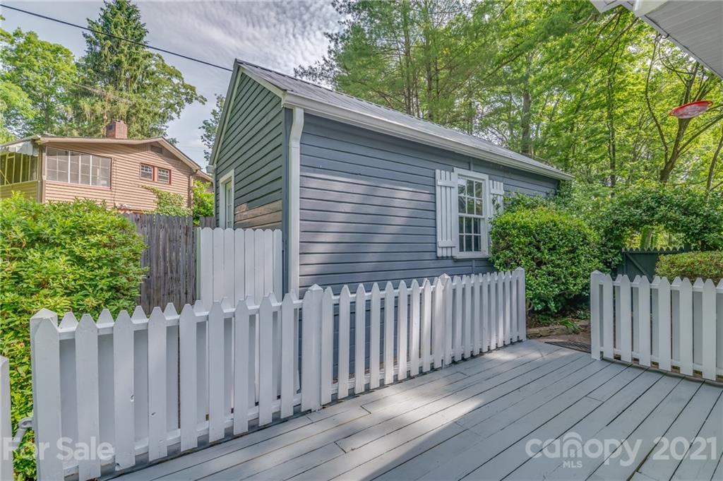75 Hidden Hill Road Tryon, NC 28782 - Photo 6 of 36 a view of a house with wooden fence