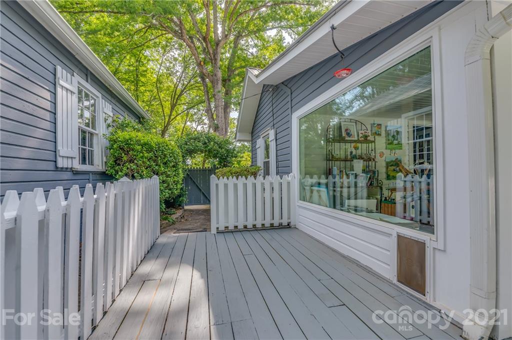 75 Hidden Hill Road Tryon, NC 28782 - Photo 7 of 36 a view of backyard with a deck and wooden floor