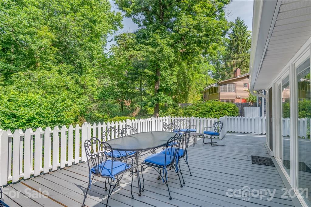 75 Hidden Hill Road Tryon, NC 28782 - Photo 8 of 36 a view of a table and chairs in the patio