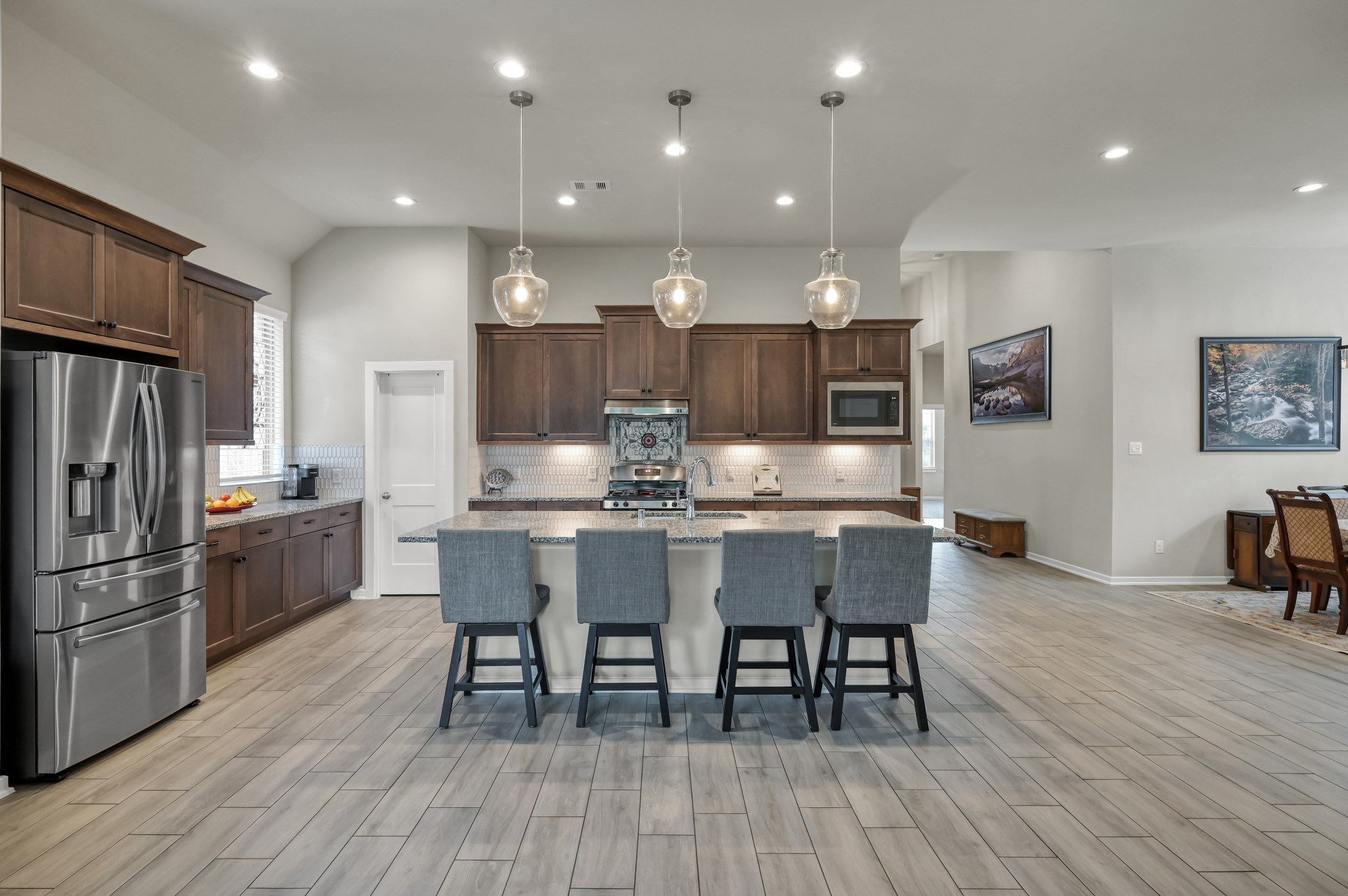 111 Yellow Perch Way Conroe, TX 77318 - Photo 8 of 35 Spacious kitchen open to living and dining areas for easy entertaining.