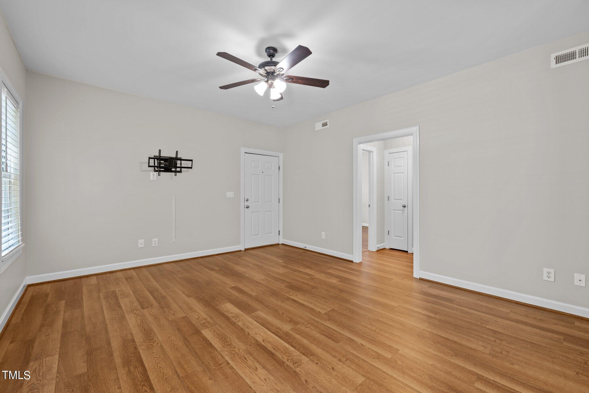 7024 Sandy Forks Road, Unit 201 Raleigh, NC 27615 - Photo 6 of 42 wooden floor in an empty room