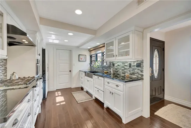 a kitchen with stainless steel appliances a stove and a refrigerator