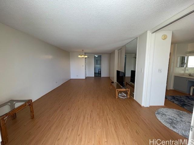 469 Ena Road, Unit 2007 Honolulu, HI 96815 - Photo 3 of 15 a very nice looking room with a big bed and a flat tv screen on dresser