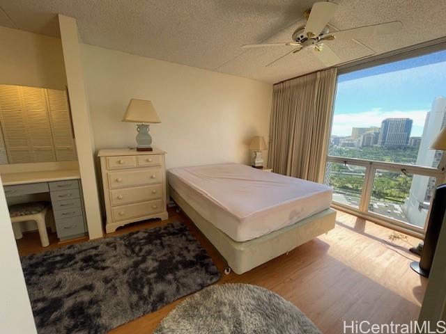 469 Ena Road, Unit 2007 Honolulu, HI 96815 - Photo 8 of 15 a bedroom with a bed and a view of balcony