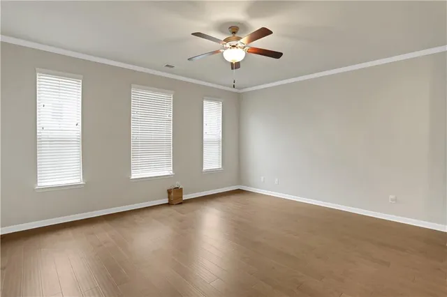 a view of kitchen with stainless steel appliances kitchen island granite countertop a stove a refrigerator a sink a oven with a dining table and chairs