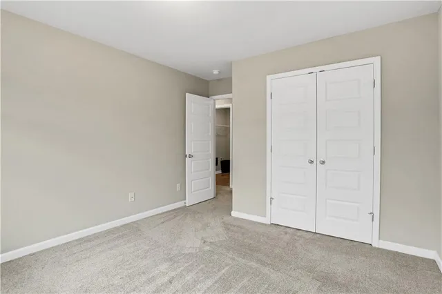 a bathroom with a sink a toilet a mirror and shower curtain