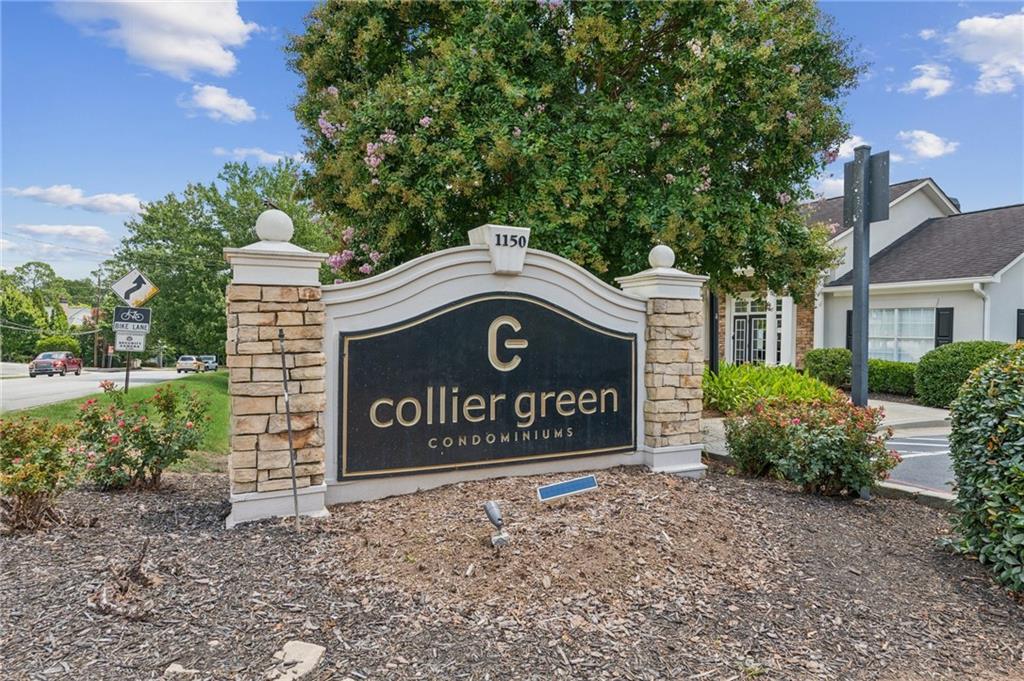 1150 Collier Road Northwest, Unit 16H Atlanta, GA 30318 - Photo 26 of 27 a sign on the side of a building