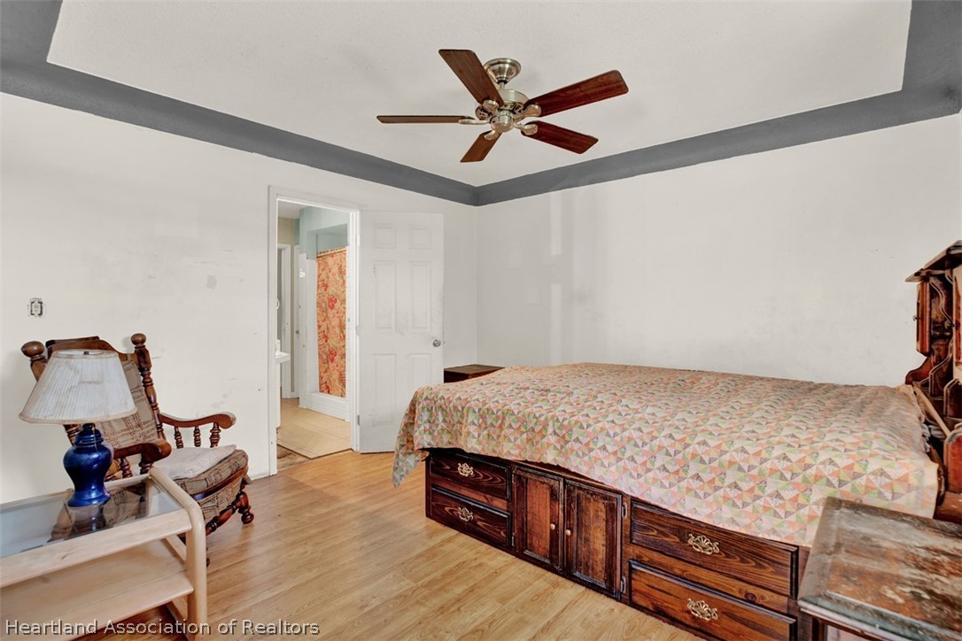 3204 Golfview Road Sebring, FL 33875 - Photo 12 of 36 a bed room with a bed furniture and a window