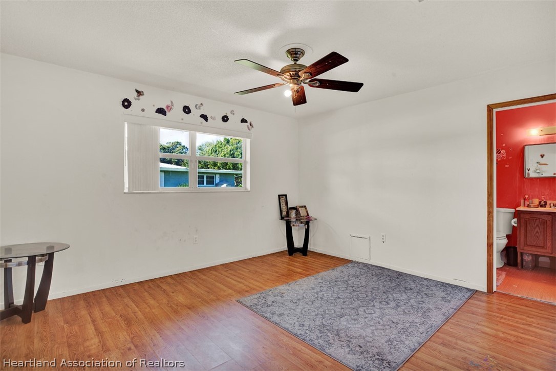 3204 Golfview Road Sebring, FL 33875 - Photo 15 of 36 a view of empty room with wooden floor