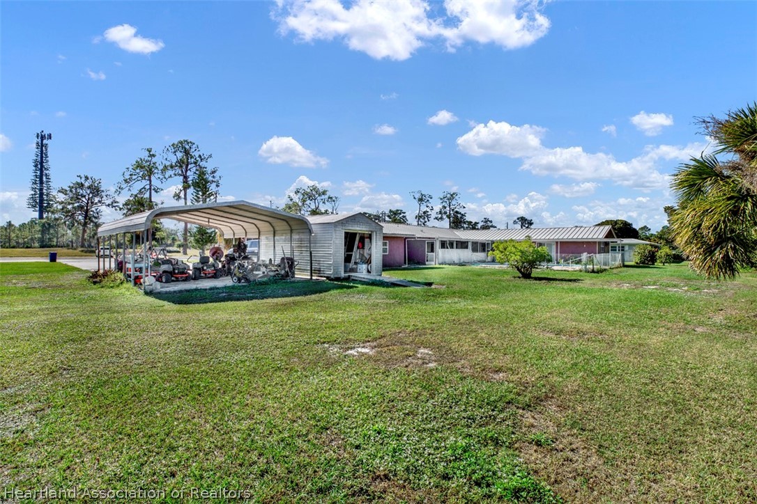 3204 Golfview Road Sebring, FL 33875 - Photo 31 of 36 a front view of a house with garden