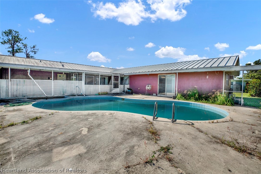 3204 Golfview Road Sebring, FL 33875 - Photo 33 of 36 a view of house with a yard and potted plants