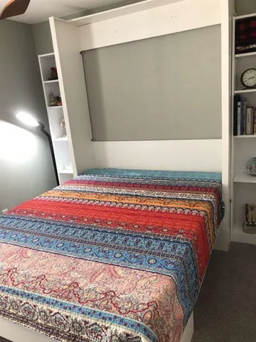a bathroom with a double vanity sink toilet and shower