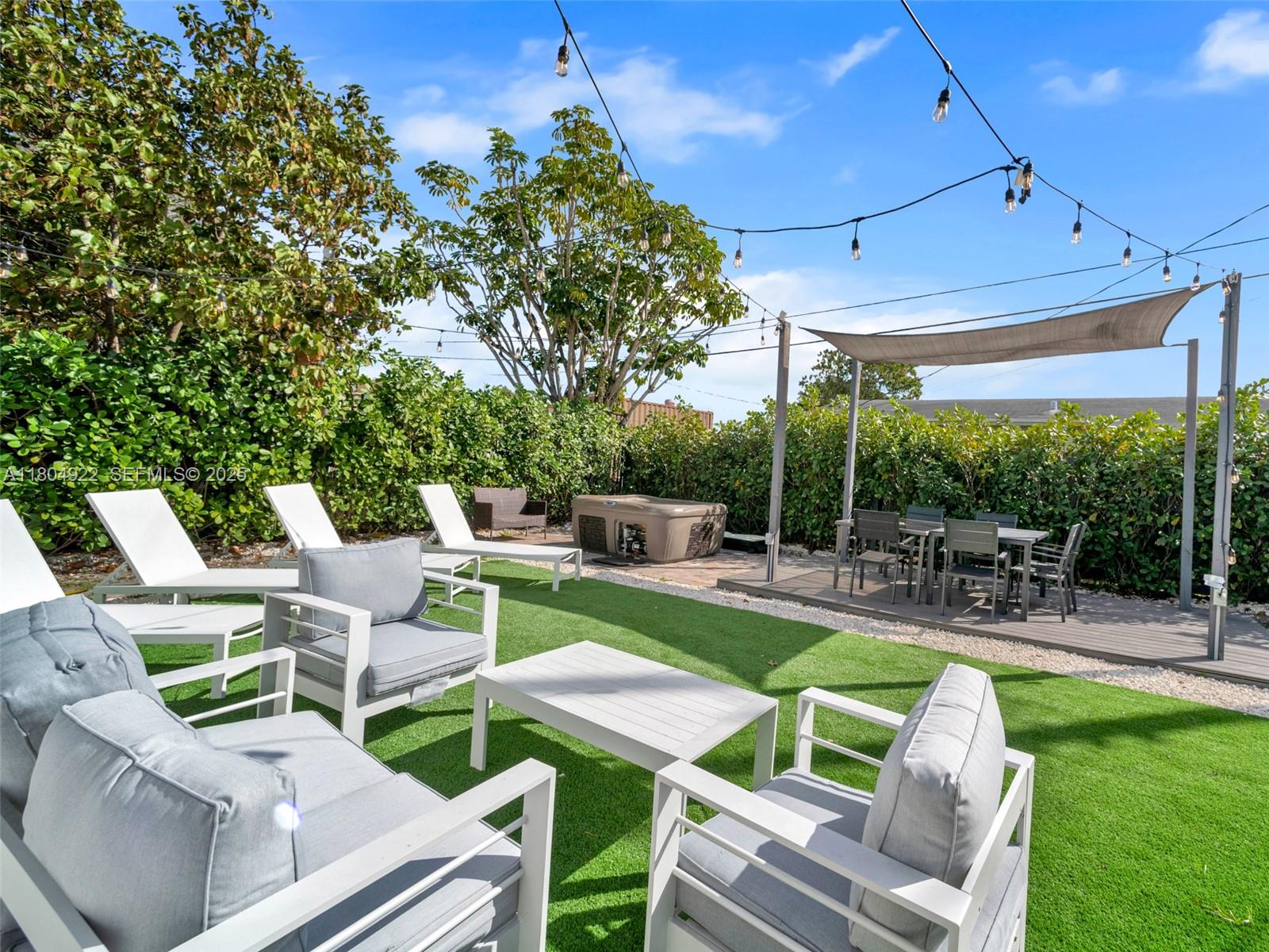 a view of a patio with chairs and a table