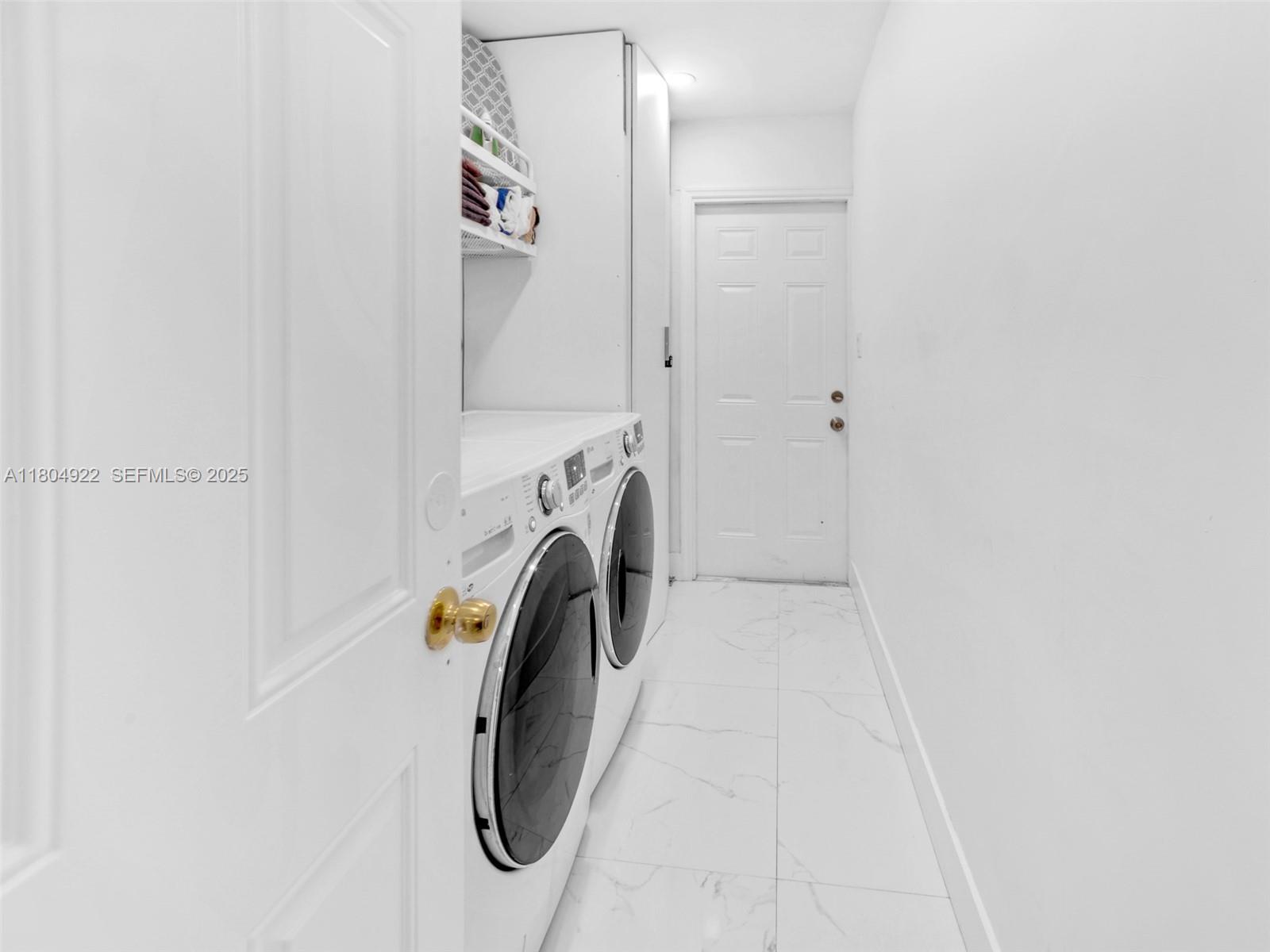 421 West Pembroke Road Hallandale Beach, FL 33009 - Photo 12 of 24 a utility room with dryer and washer