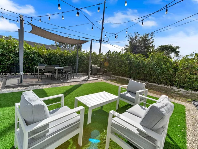 a view of yard with outdoor seating