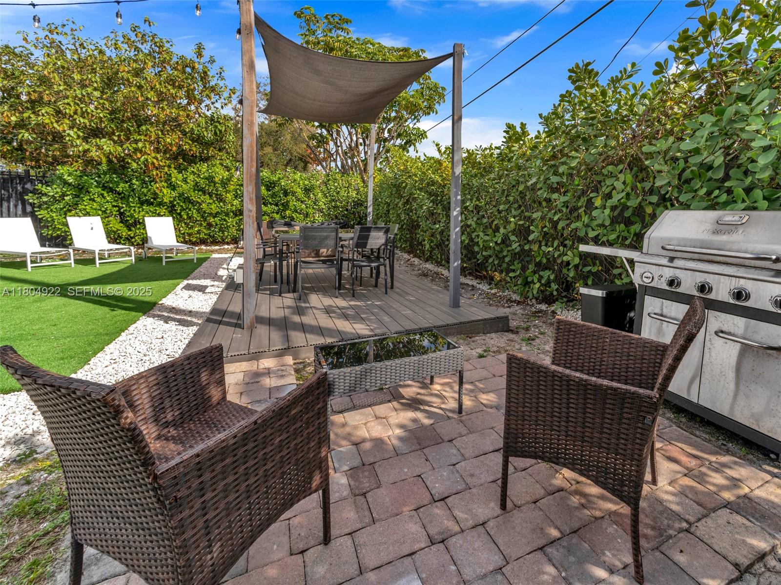421 West Pembroke Road Hallandale Beach, FL 33009 - Photo 23 of 24 a view of a patio with a yard