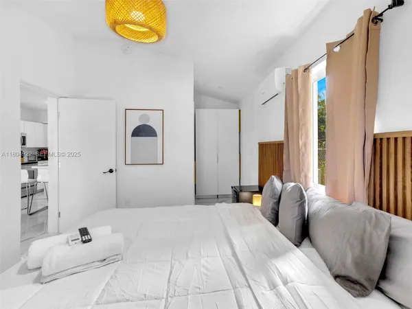 a bedroom with a bed and a cabinets