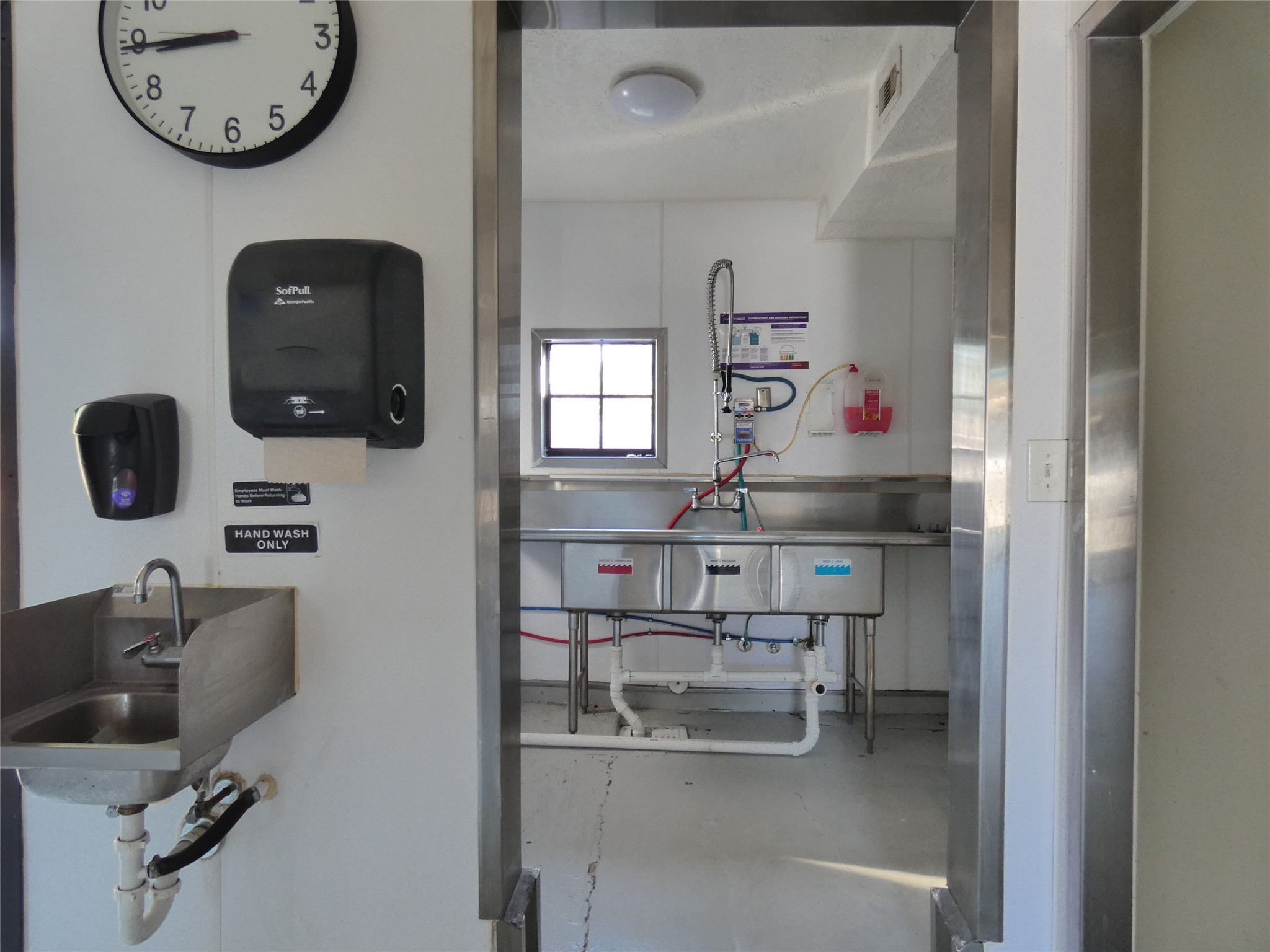 1704 Avenue D Rosenberg, TX 77471 - Photo 15 of 27 a kitchen with a refrigerator and a sink