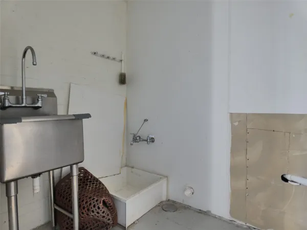 a bathroom with a tub and shower