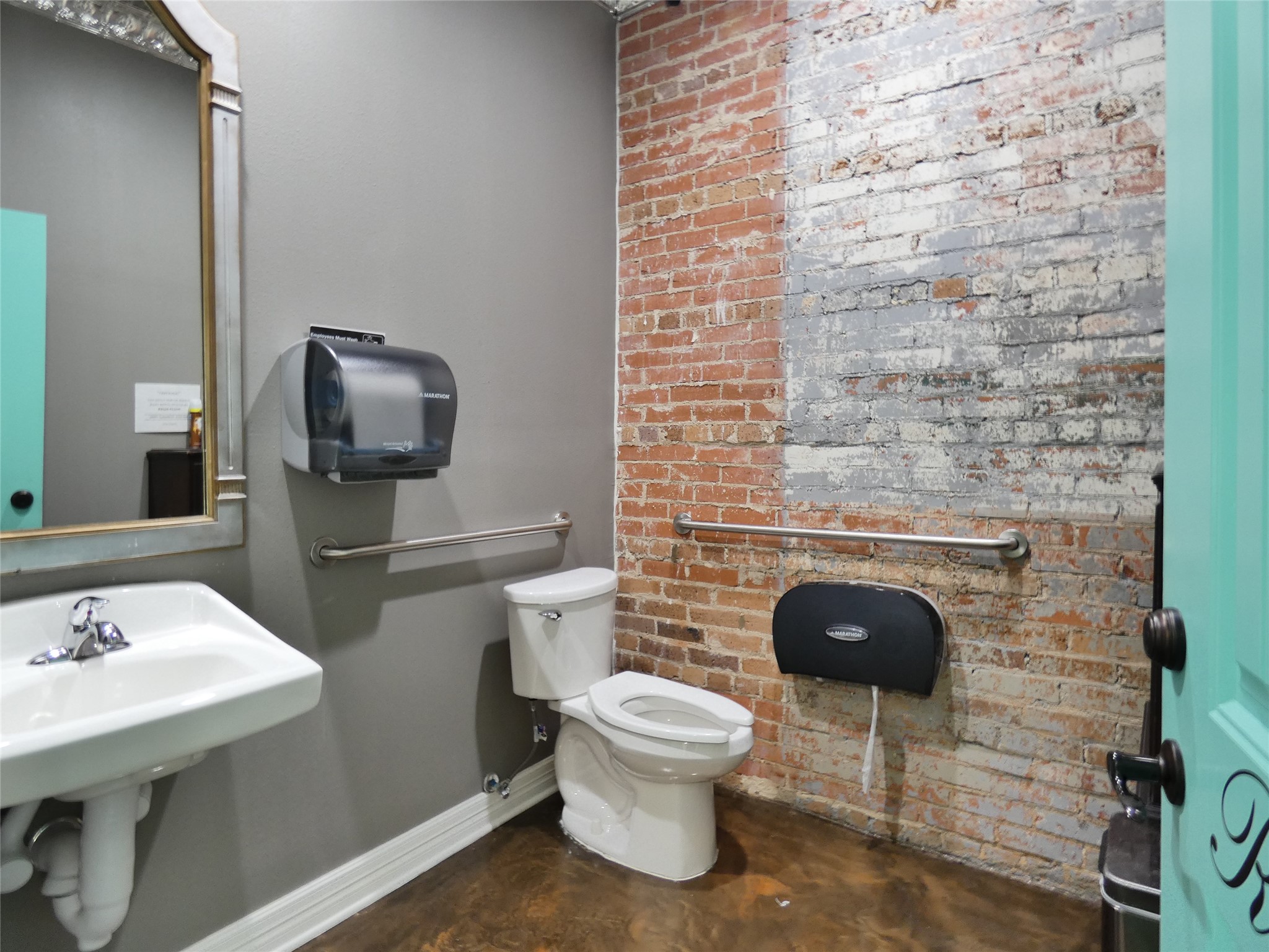 1704 Avenue D Rosenberg, TX 77471 - Photo 25 of 27 a bathroom with a toilet a sink and mirror