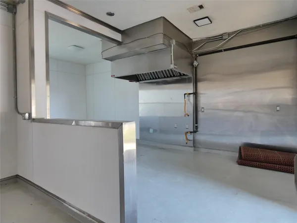 a view of a room with racks on the wall