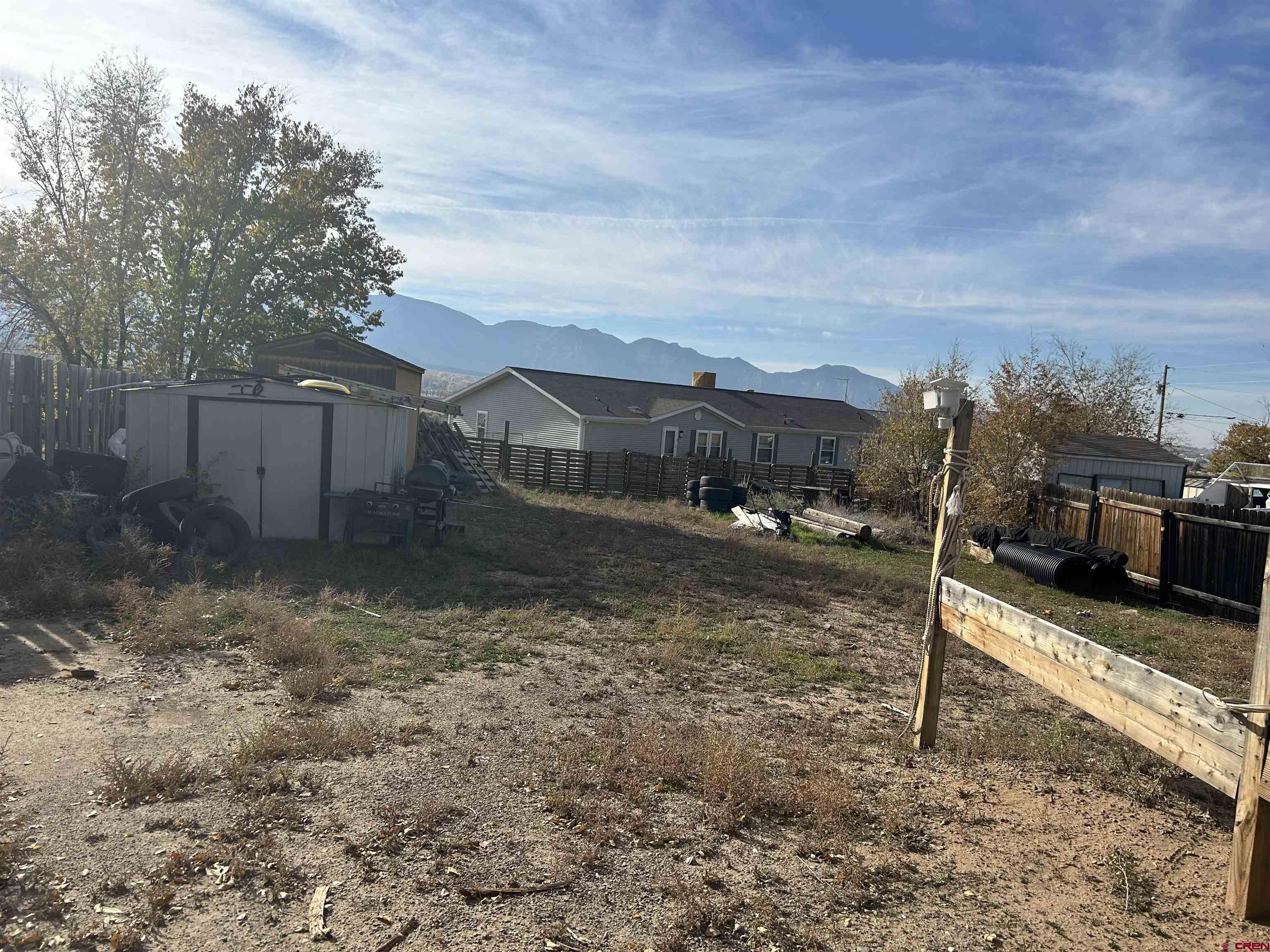 29 West Andrew Lane Cortez, CO 81321 - Photo 1 of 6 a view of a yard with wooden fence