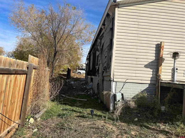 a view of a back yard of the house