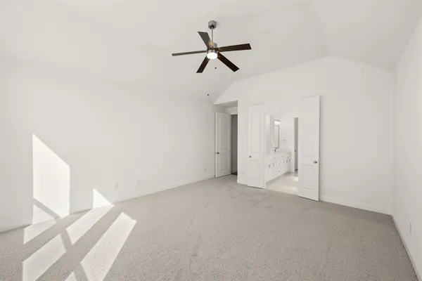 a view of a room with a ceiling fan