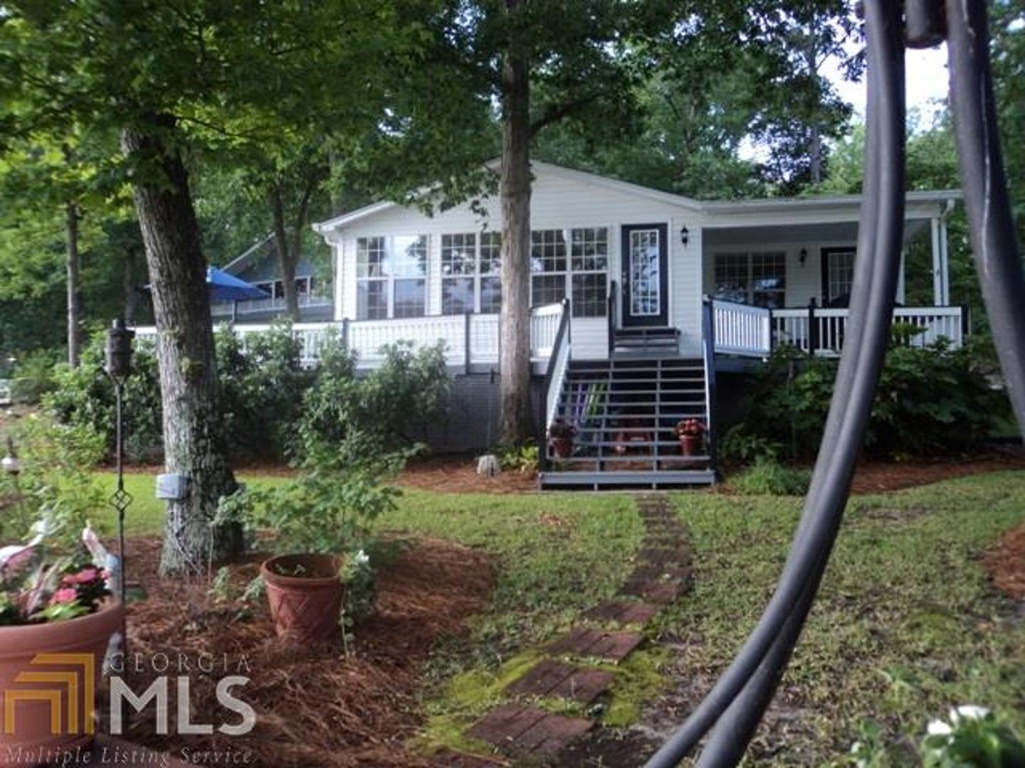160 Summit View Road Jackson, GA 30233 - Photo 1 of 1 a front view of a house with garden