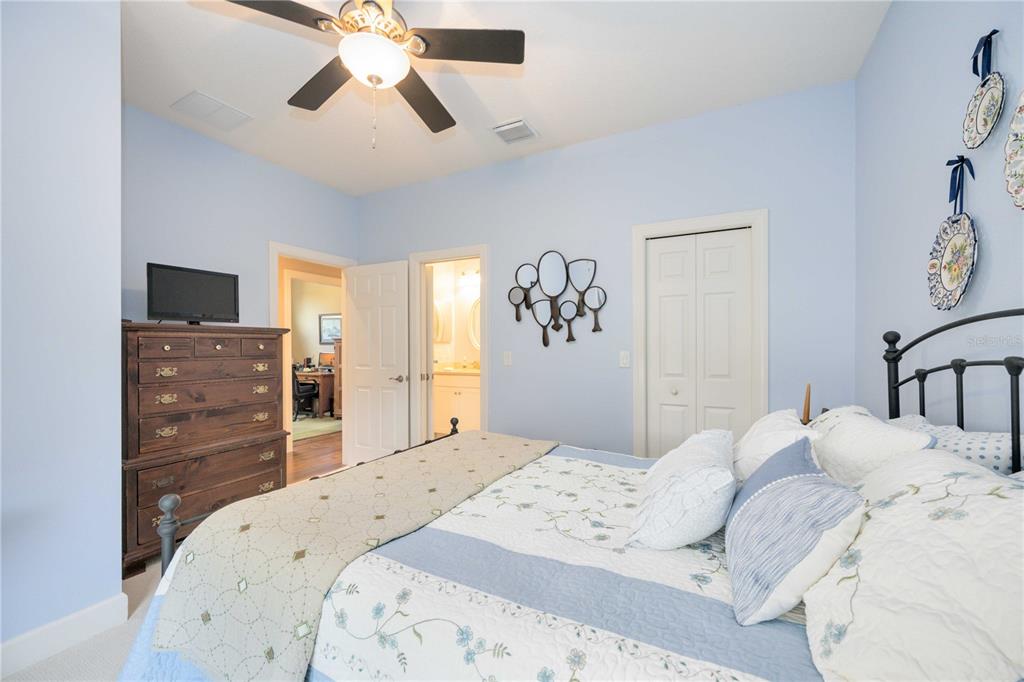 13202 Torresina Terrace Lakewood Ranch, FL 34211 - Photo 18 of 35 a bedroom with a bed and a chandelier