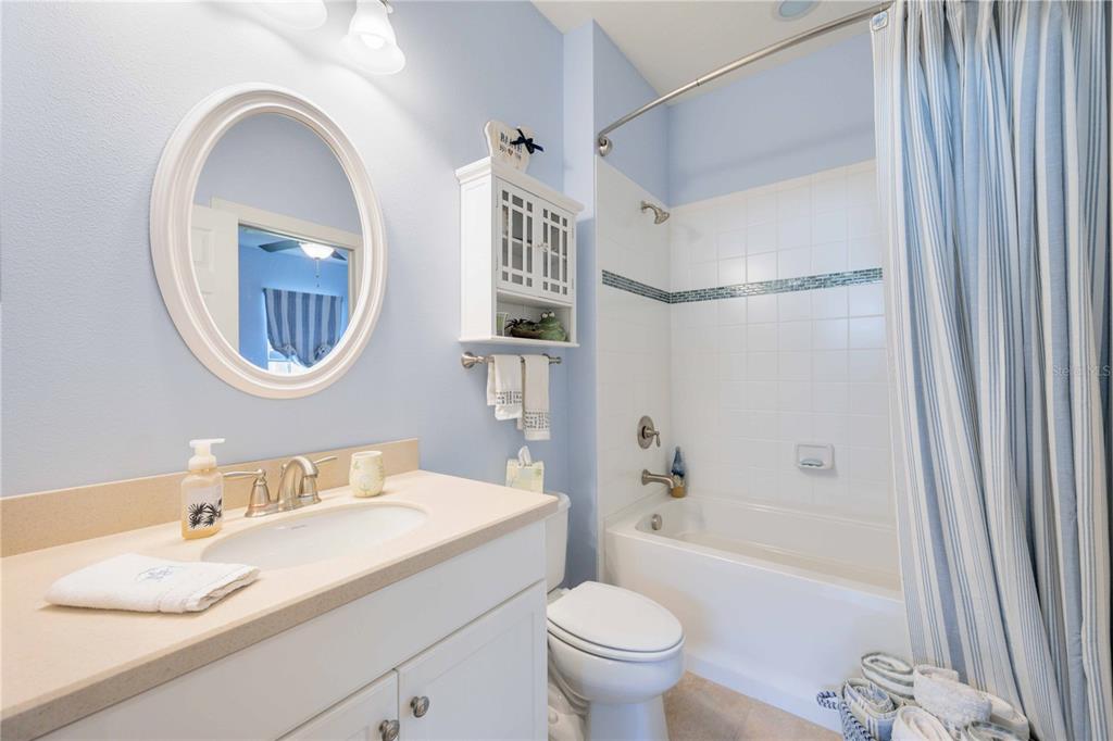 13202 Torresina Terrace Lakewood Ranch, FL 34211 - Photo 19 of 35 a bathroom with a granite countertop sink mirror toilet and bathtub
