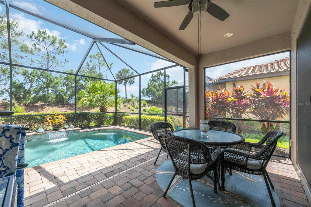 13202 Torresina Terrace Lakewood Ranch, FL 34211 - Photo 23 of 35 a dining room with furniture and a floor to ceiling window