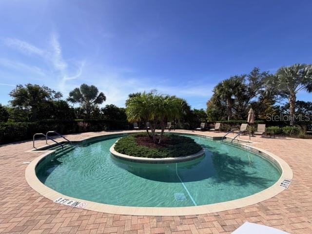 13202 Torresina Terrace Lakewood Ranch, FL 34211 - Photo 33 of 35 a view of a swimming pool with a yard