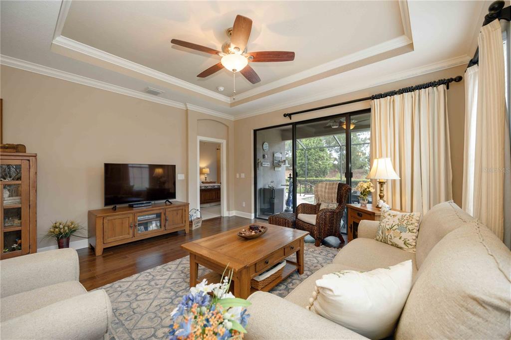 13202 Torresina Terrace Lakewood Ranch, FL 34211 - Photo 5 of 35 a living room with furniture and a flat screen tv