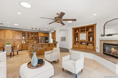 a living room with furniture a fireplace and a table