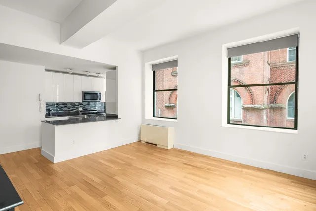 a kitchen with stainless steel appliances granite countertop a stove and a refrigerator
