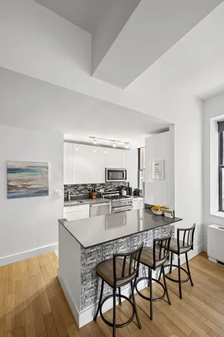 a kitchen with a table and chairs in it
