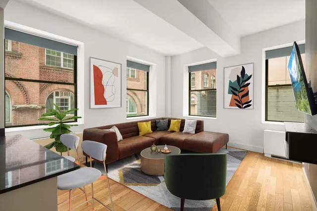 a living room with furniture and a window