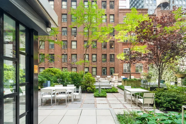 a view of a chairs and table in a patio