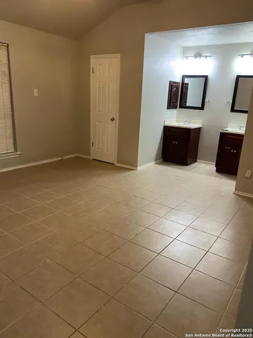 a view of a livingroom and a bathroom