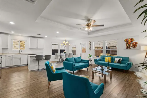 a living room with fireplace furniture and a wooden floor