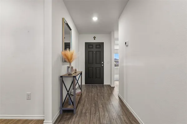 a view of entryway with wooden floor