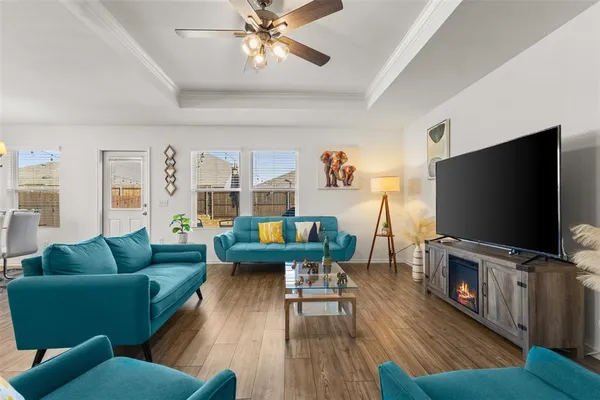 a living room with furniture and a flat screen tv