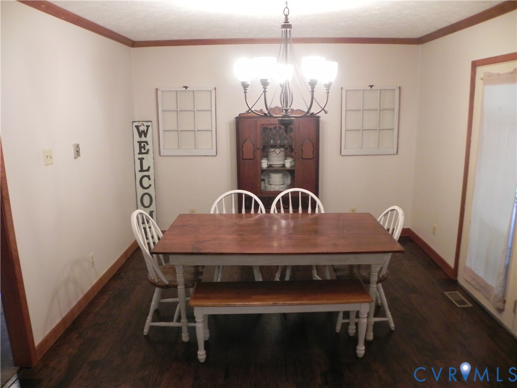 830 Grapevine Road Sandston, VA 23150 - Photo 5 of 16 Dining area featuring wood-finish flooring, a deco