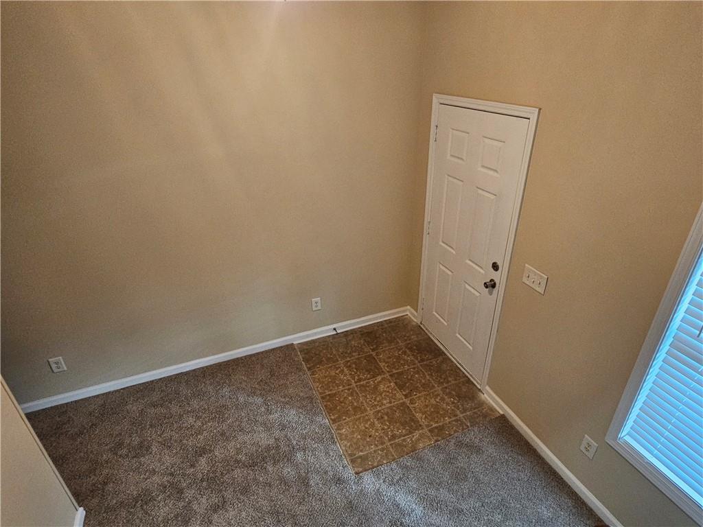 2160 Spikerush Way Buford, GA 30519 - Photo 12 of 29 an empty room with a bench