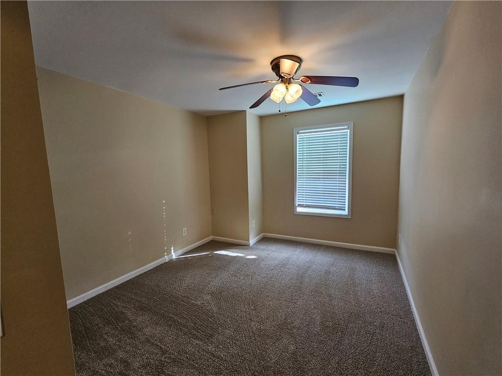 2160 Spikerush Way Buford, GA 30519 - Photo 17 of 29 a view of an empty room with a window