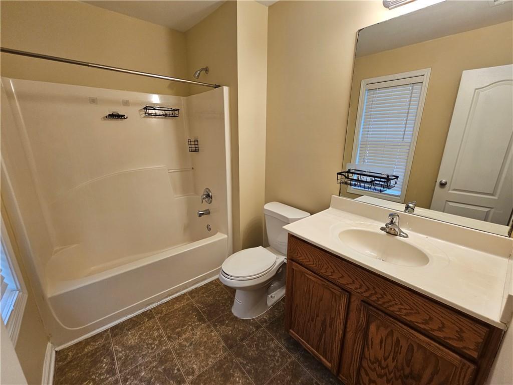 2160 Spikerush Way Buford, GA 30519 - Photo 20 of 29 a bathroom with a sink a toilet and shower