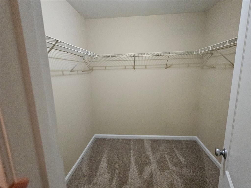 2160 Spikerush Way Buford, GA 30519 - Photo 22 of 29 a view of a room with racks on the wall