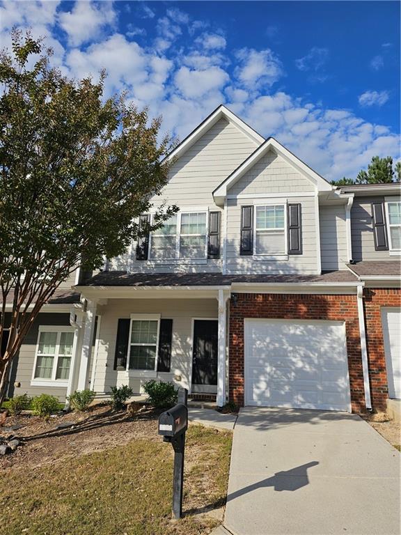 2160 Spikerush Way Buford, GA 30519 - Photo 27 of 29 a front view of a house with garden